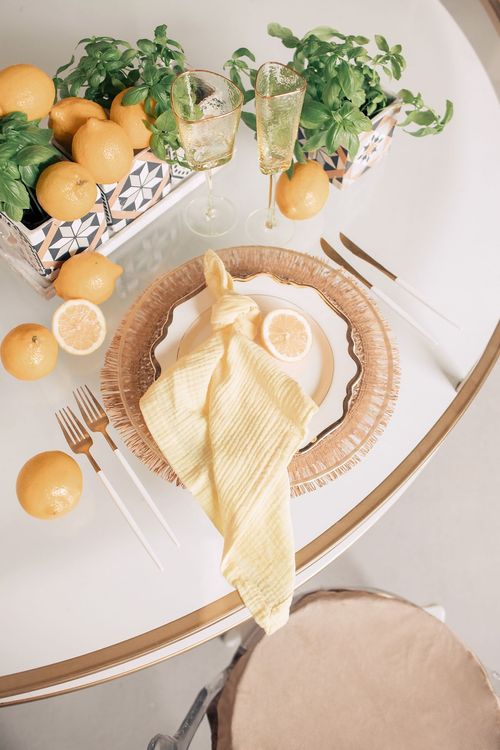 Accent table settings at round table