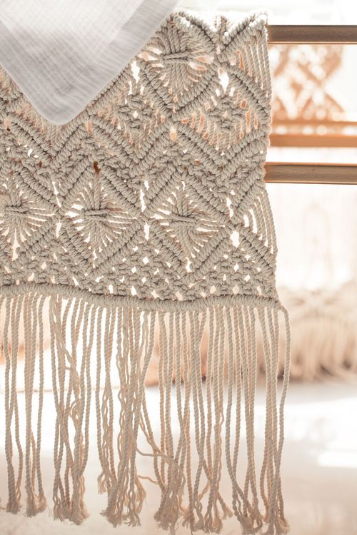 Beige boho table setting with ottomans