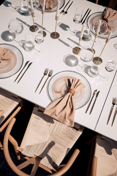 Beige set with boho accents on a white rectangular table