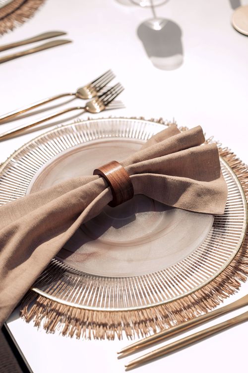 Beige set with boho accents on a white rectangular table