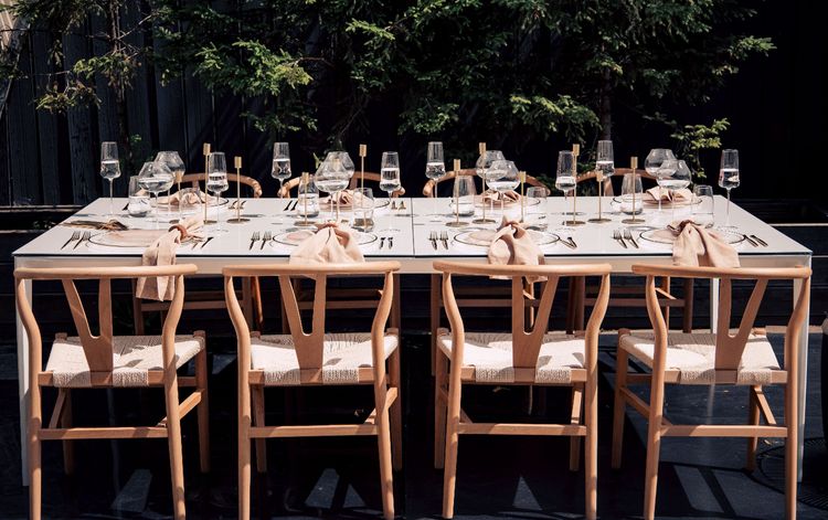 Beige set with boho accents on a white rectangular table