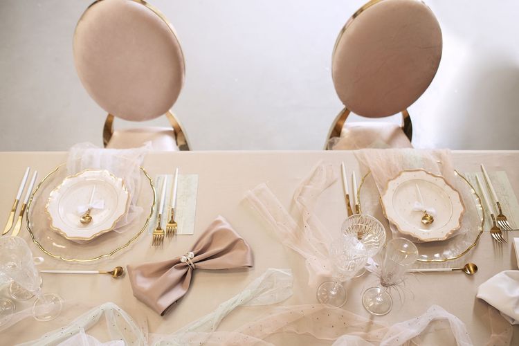 Beige table setting at rectangular table