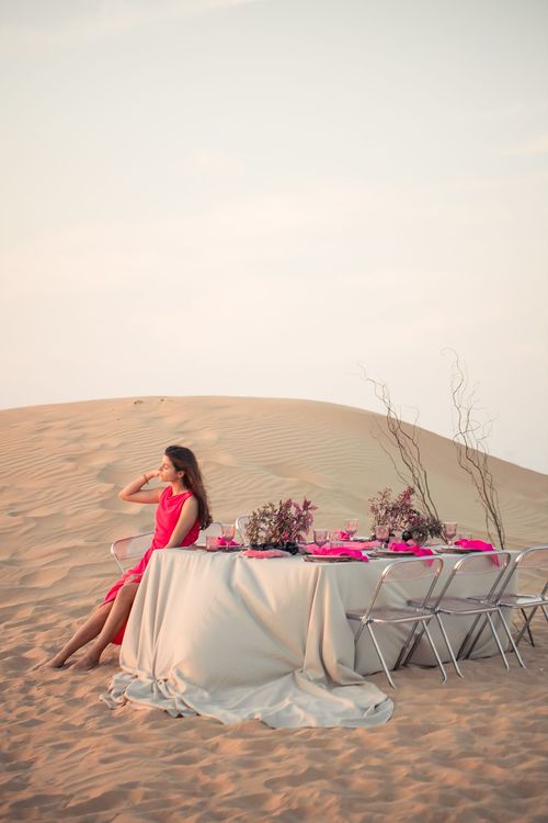 Beige desert  tablescape with fuchsia accents