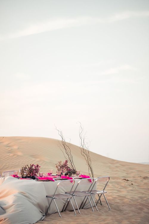 Beige desert  tablescape with fuchsia accents