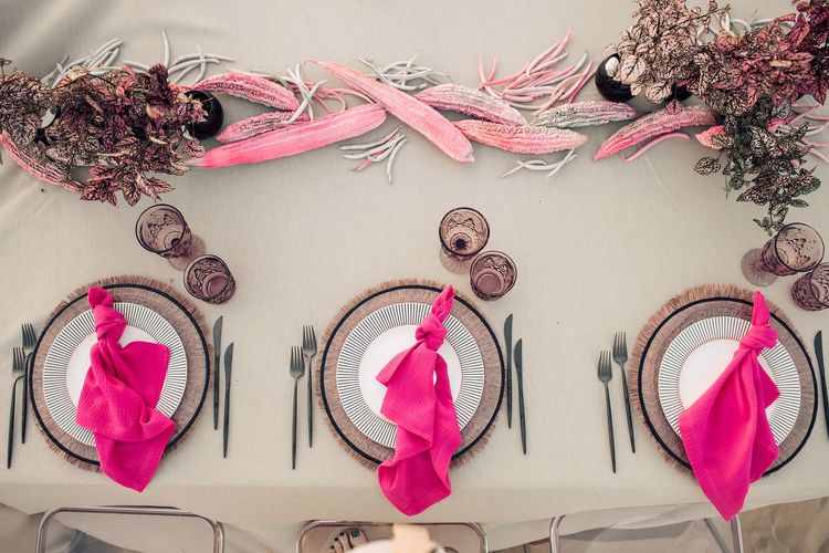 Beige desert  tablescape with fuchsia accents