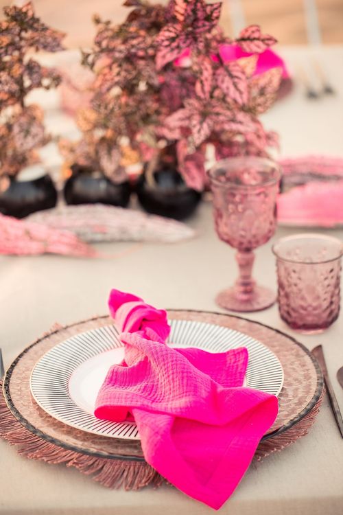 Beige desert  tablescape with fuchsia accents