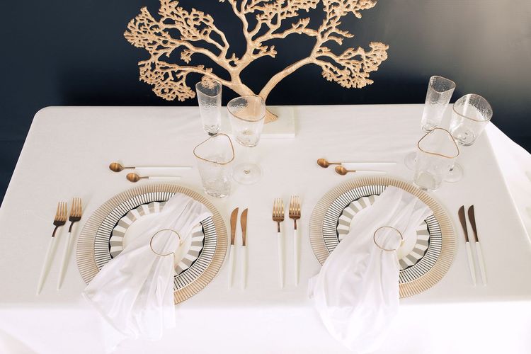 White set with gold accents on a rectangular table