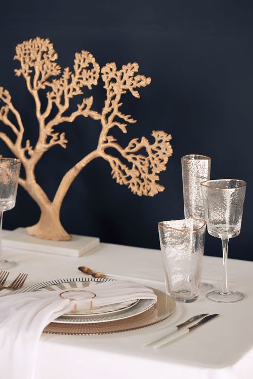 White set with gold accents on a rectangular table