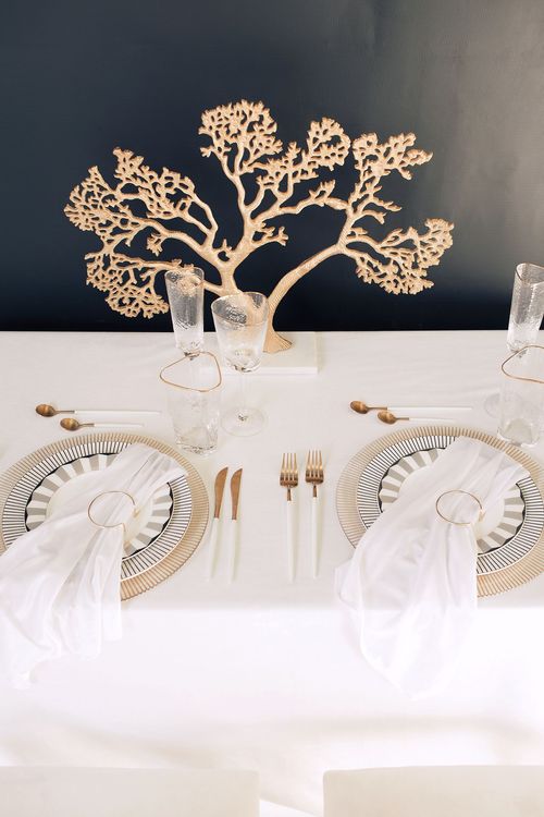 White set with gold accents on a rectangular table