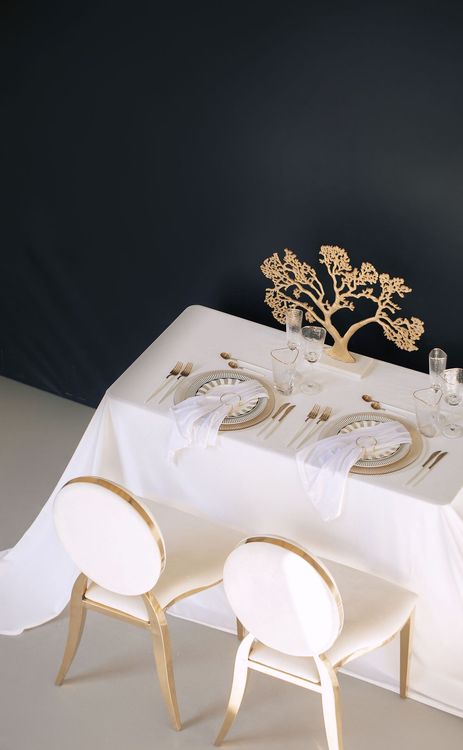 White set with gold accents on a rectangular table