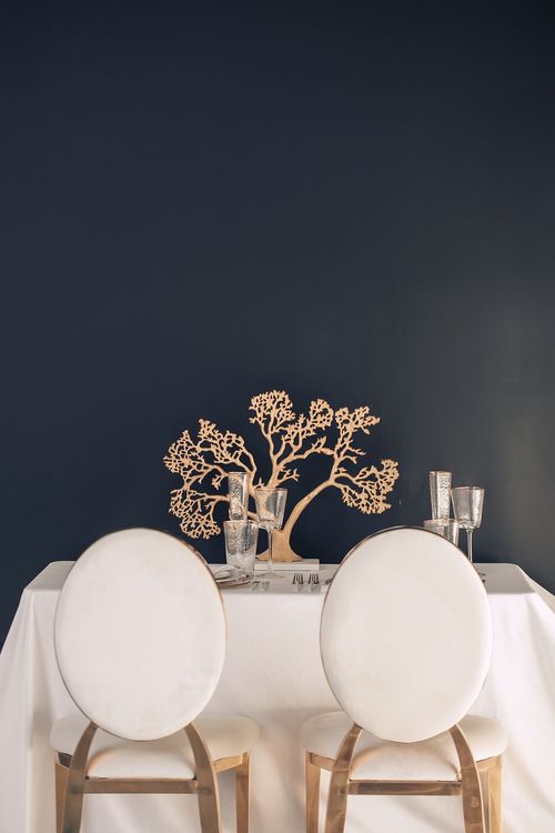 White set with gold accents on a rectangular table