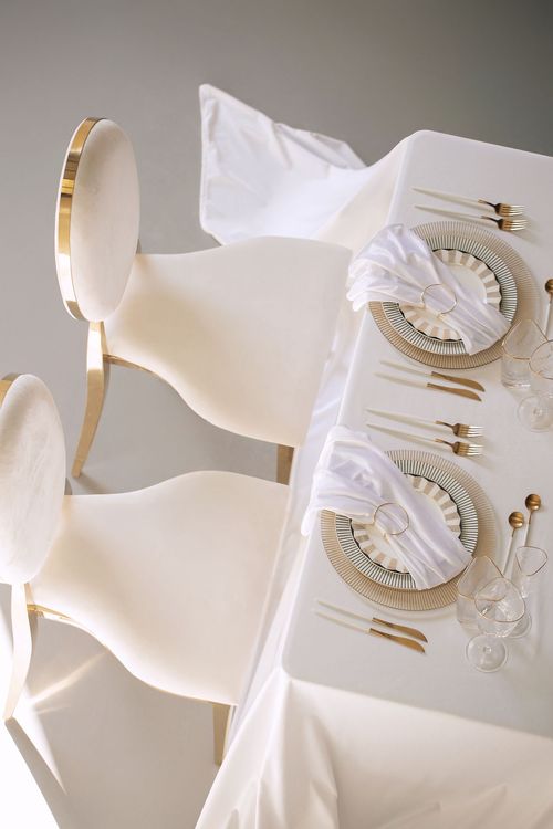 White set with gold accents on a rectangular table