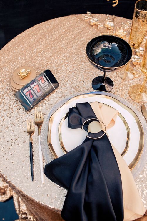 Black-gold table setting at round table