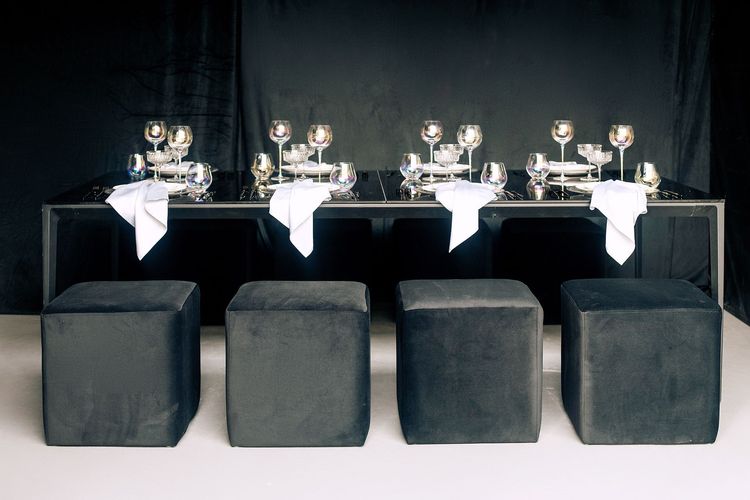 Black-white table setting at rectangular table