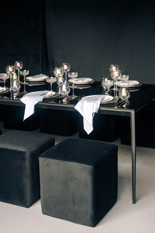 Black-white table setting at rectangular table