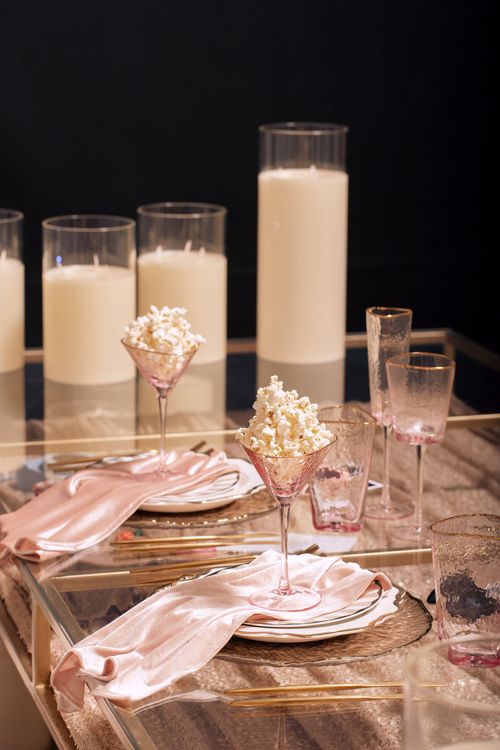 Candlelit Duo — Sequin Table, Cozy Poufs, “Titanic”