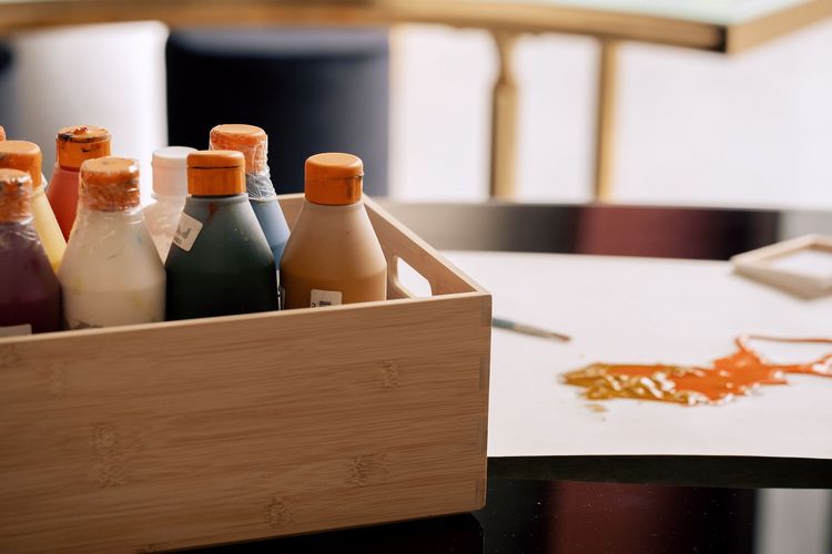 Black and white serpentine tables with velvet poufs