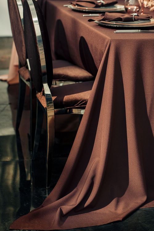 Chocolate table setting at rectangular table