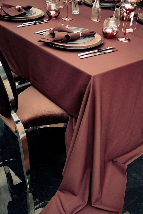 Chocolate table setting at rectangular table