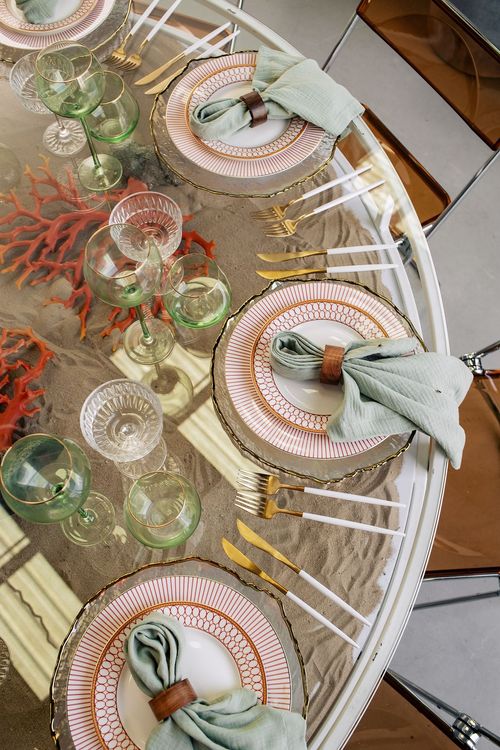 Glass round table coral dune decor