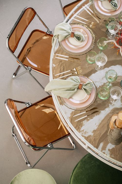 Glass round table coral dune decor