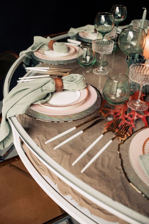 Glass round table coral dune decor
