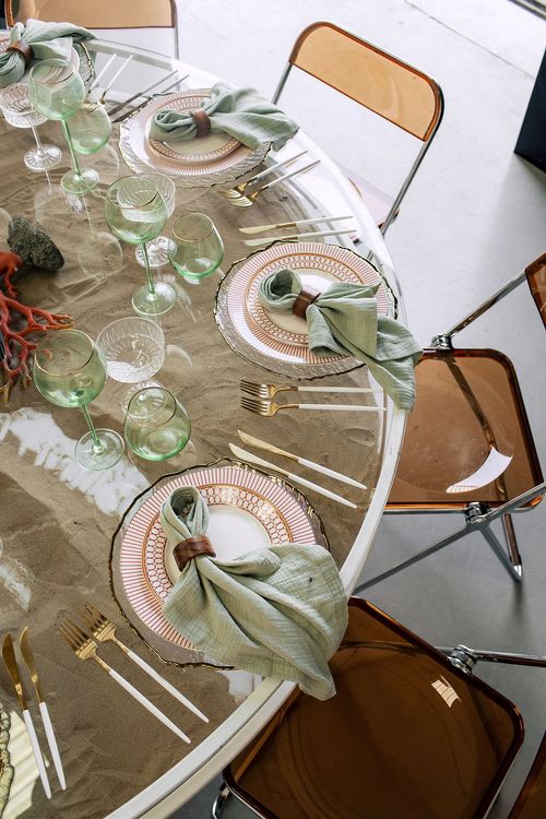 Glass round table coral dune decor