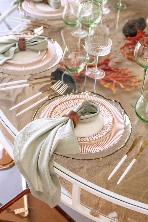 Glass round table coral dune decor