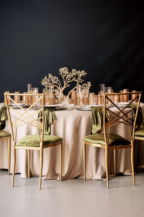 Green table setting at round table
