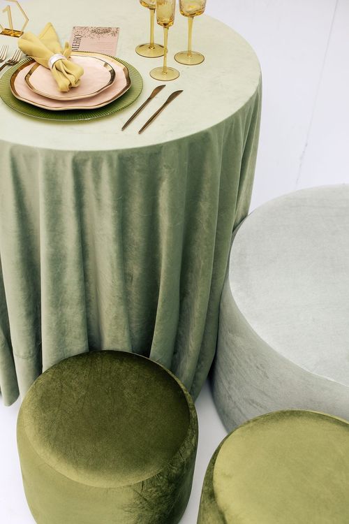 Green table setting with ottomans