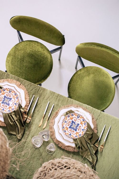 Green velvet tablescape rattan chairs