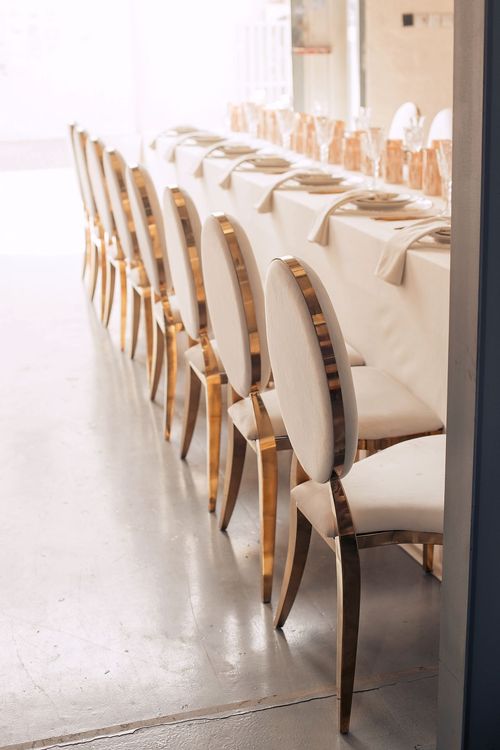 Ivory table service at long rectangular table