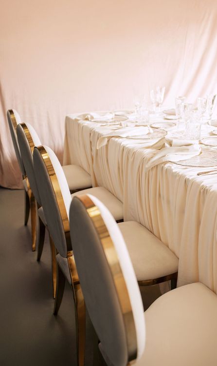 Ivory table setting at rectangular table