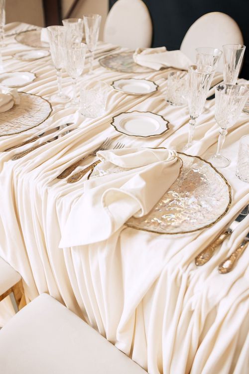 Ivory table setting at rectangular table