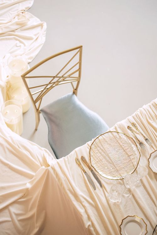 Ivory table setting at rectangular table