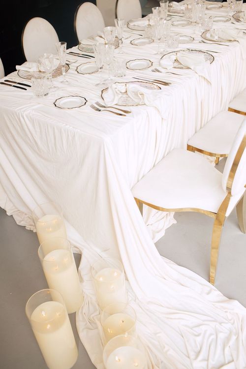 Ivory table setting at rectangular table