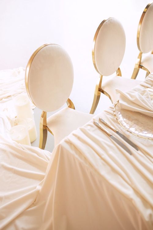 Ivory table setting at rectangular table