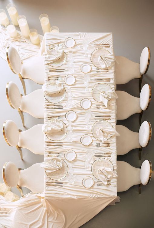 Ivory table setting at rectangular table