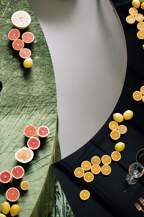 Orange green serpentine table set with poufs