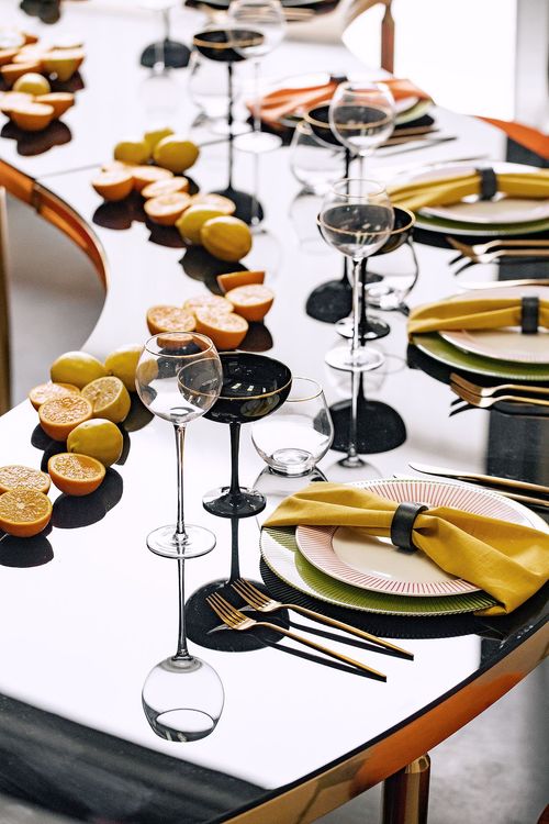 Orange green serpentine table set with poufs