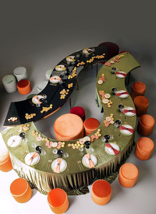 Orange green serpentine table set with poufs