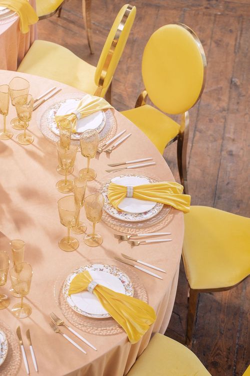 Peach-lavender table setting at caterpillar table