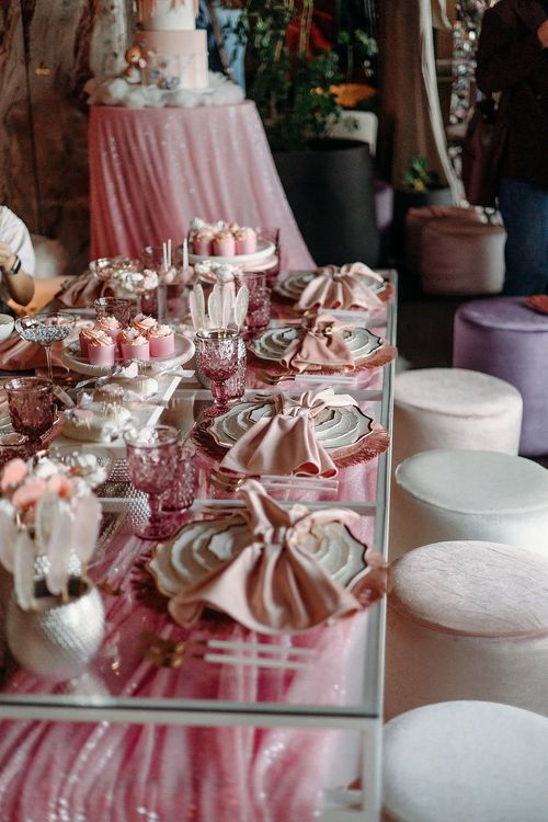 Pink kids party with velvet poufs