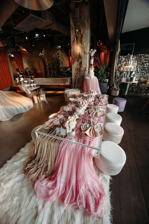 Pink kids party with velvet poufs