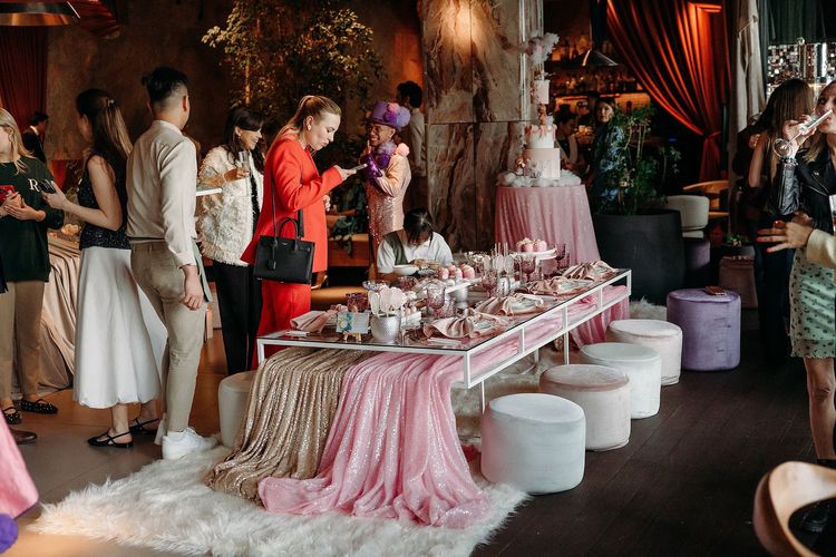 Pink kids party with velvet poufs