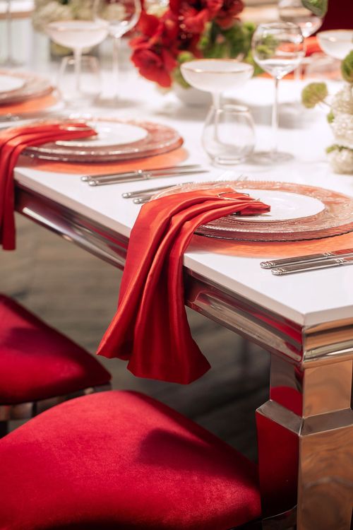 Red table setting at rectangular table