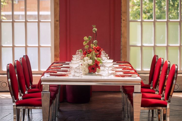 Red table setting at rectangular table