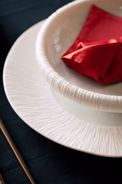 Red-black table setting at rectangular table