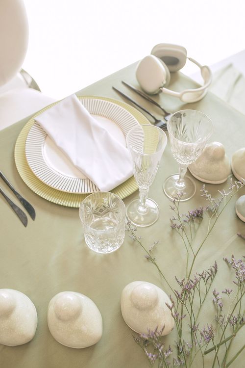 Soft green table setting at rectangular table