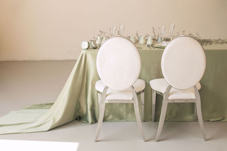 Soft green table setting at rectangular table